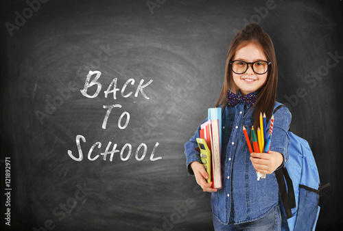 School concept. Cute girl w...
