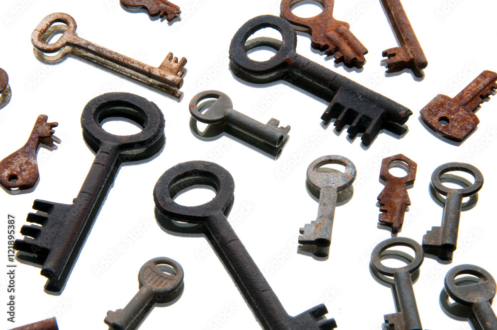 Old rusty keys on white background. Mirror Old rusty keys on white background. Mirror