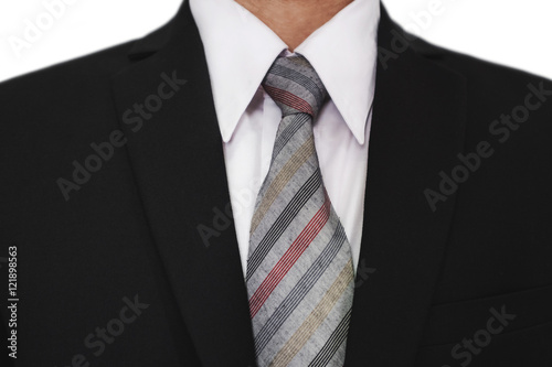 Close-up of businessman wearing black suit with a gray tie, white shirt