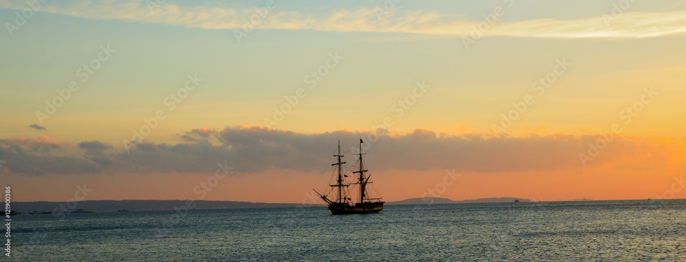Crimson Sunrise over the Red Sea sailing ship at anchor