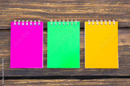 Colorful scribblers  on wooden background photo