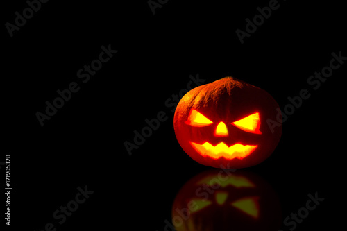 Pumpkin, Halloween pumpkin lantern, Pumpkin jack o lantern shiny head on black background.