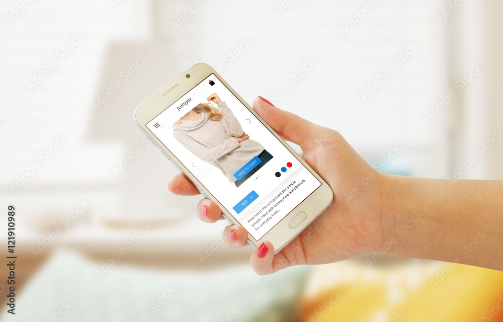 Fototapeta premium Online shopping with smart phone in woman hand. Web site or app on phone display. Room interior in background.