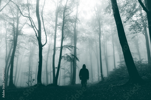 Horror dark man appears in foggy forest