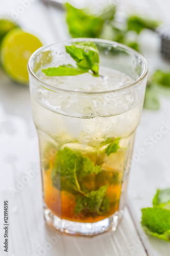 Mojito Cocktail and Ingredients on Light Wooden Table