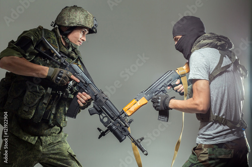 Russian soldier fighting against a terrorist photo