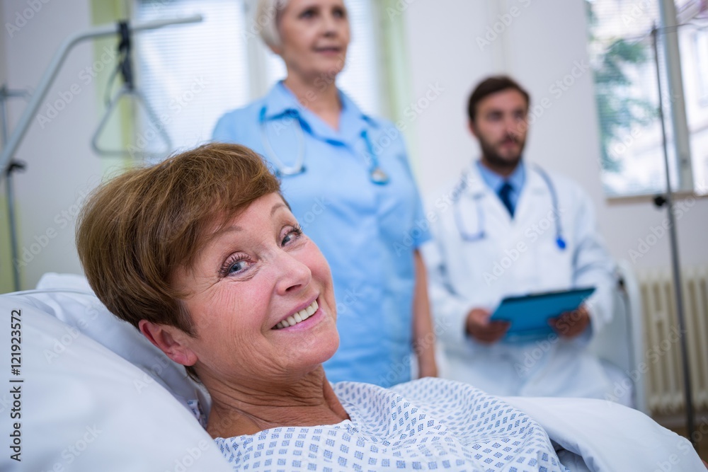 Fototapeta premium Portrait of smiling patient lying on bed