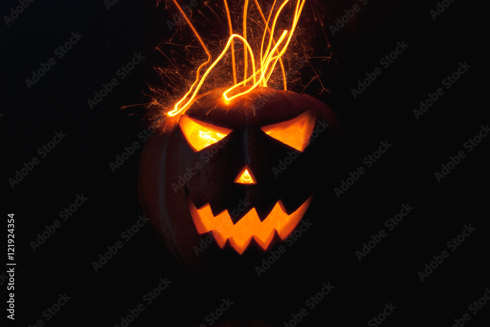 Jack-o ' - lantern scary shining eyes in the darkness. Jack-o ' - lantern scary shining eyes in the darkness.