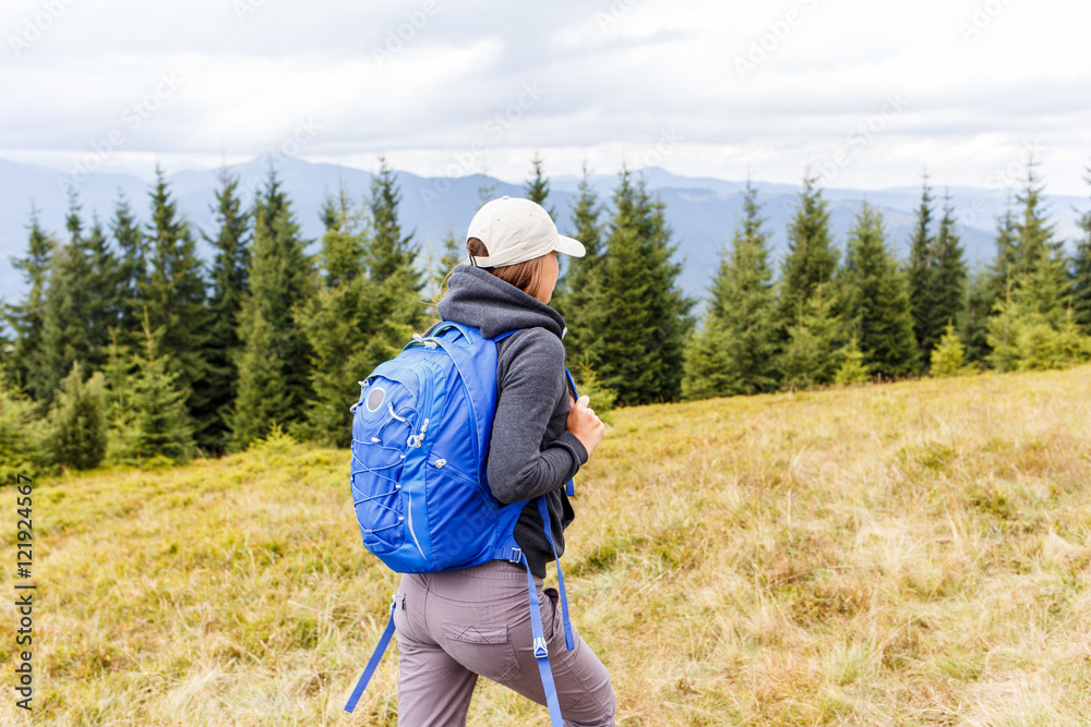 Young backpacker woman enjoying mountain trip Young backpacker woman enjoying mountain trip