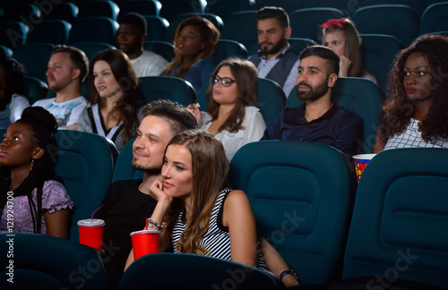 Lovely young couple on a date at the cinema