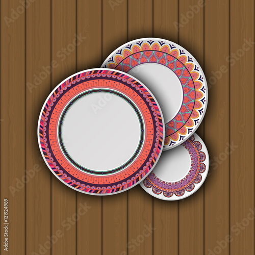 Set of decorative plates with a ethnic tribal ornament of handwork and an empty space in the center.