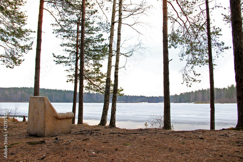 The old armchair in the forest on the Lake Shore