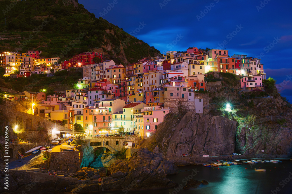 Waterfront cliff town of Manarola at night, Cinque Terre, Liguria, Italy