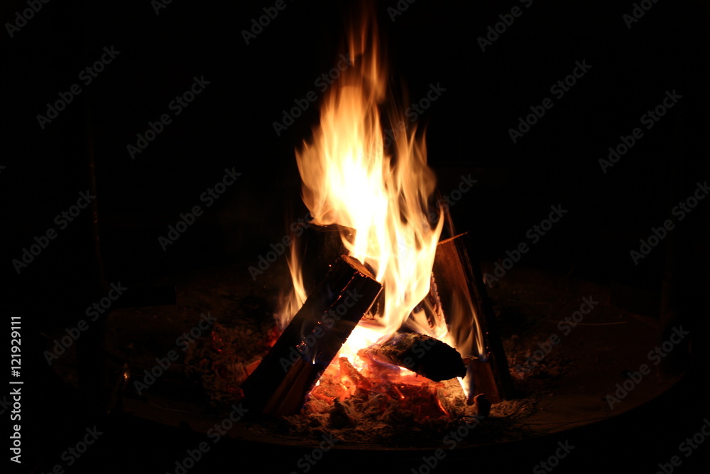 Bonfire in a camping place at the warm summer night Bonfire in a camping place at the warm summer night