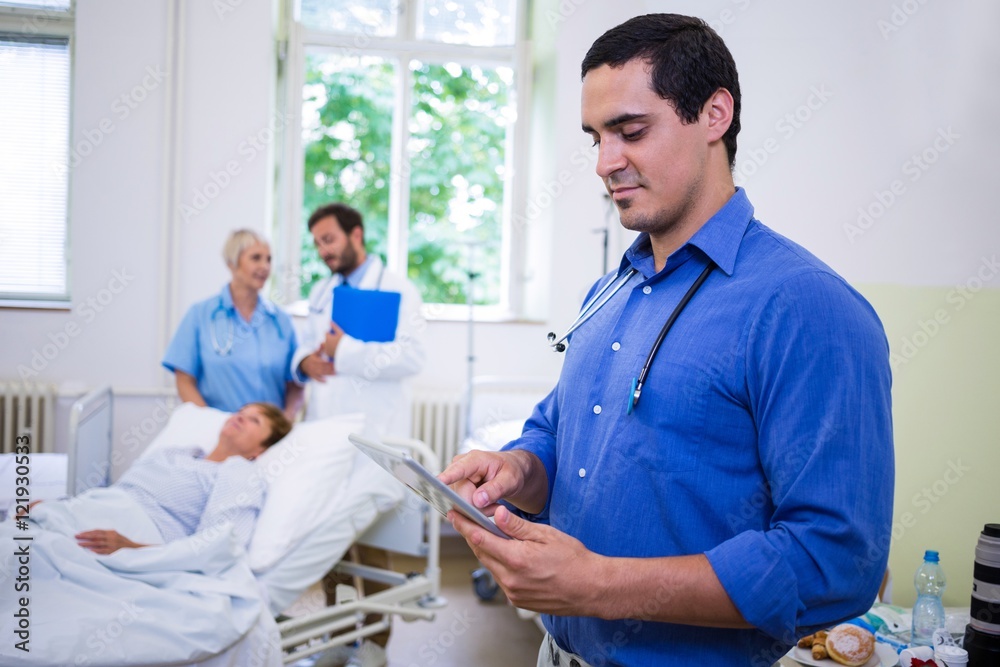Confident doctor using digital tablet Confident doctor using digital tablet