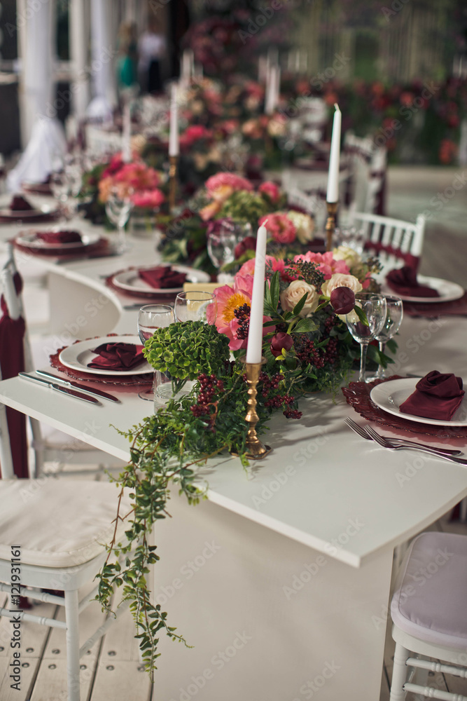 View of the wedding table decorated with flowers View of the wedding table decorated with flowers