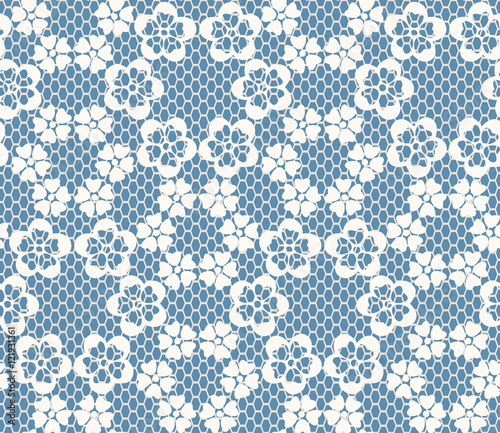 Seamless white lace pattern on blue background