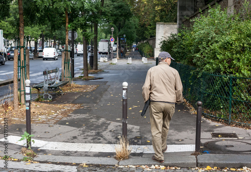 Old man alone on street