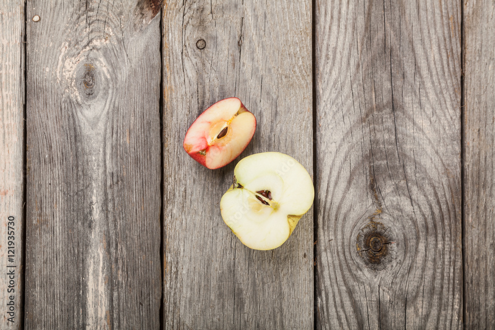 Apples on gray old planks wood table