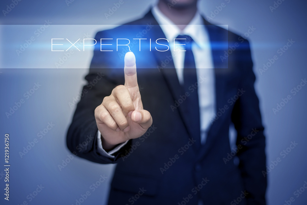 Businessman hand touching EXPERTISE button on virtual screen Businessman hand touching EXPERTISE button on virtual screen