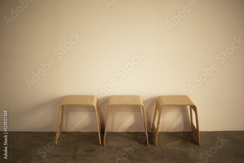 Three stools in a row in artistic impression