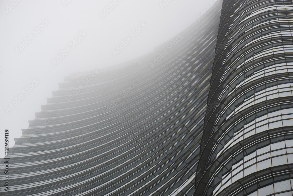 Fototapeta premium Skyscraper in the fog in Milan