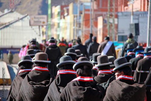 The back of Bolivian women participating in the procession © olamiabo