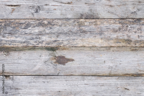 wooden background from old grey textured boards with little gap between it 