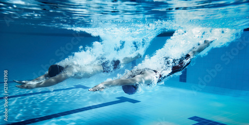 Fotografie, Obraz swimmer Jump from platform jumping A swimming pool.Underwater ph