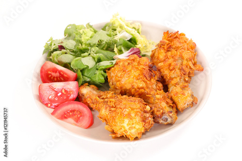 fried chicken with salad and tomato