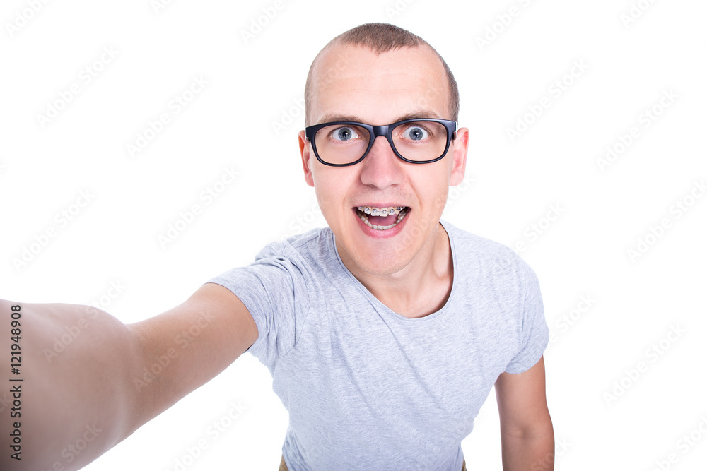 funny young man in glasses with braces on teeth taking selfie ph funny young man in glasses with braces on teeth taking selfie ph