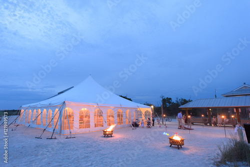 wedding reception tent on beach evening shot
