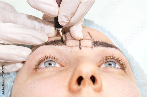 Mikrobleyding eyebrows workflow in a beauty salon © lester120