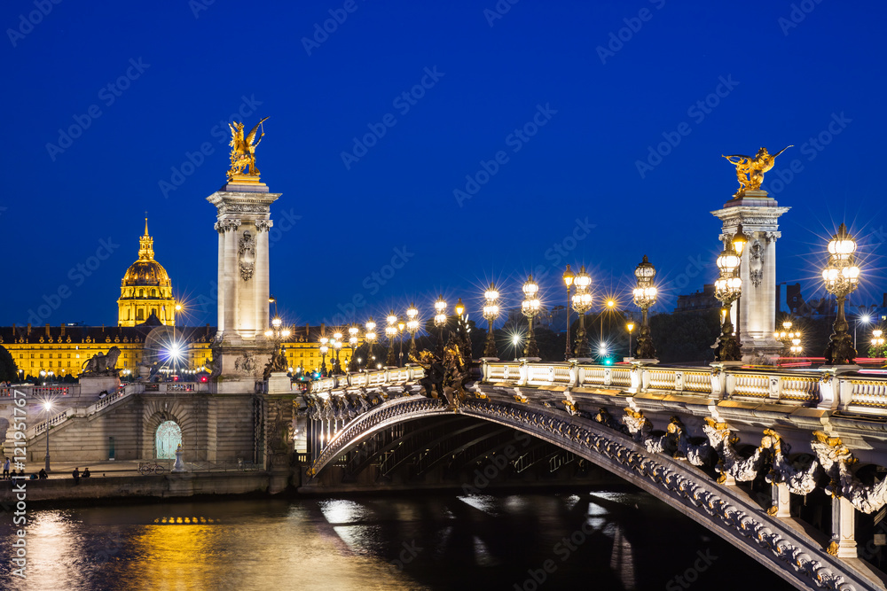 Pont Alexandre III bridge over river Seine with beautiful night