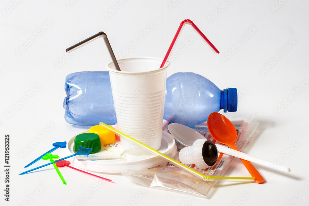 Assorted household plastic waste on white background Assorted household plastic waste on white background
