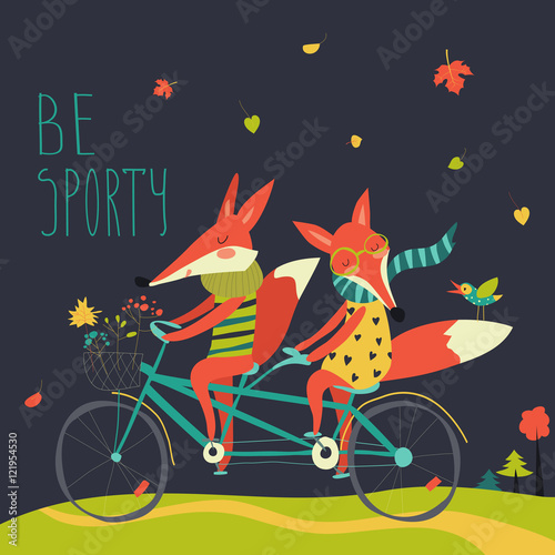 Cute couple foxes ride tandem bicycle