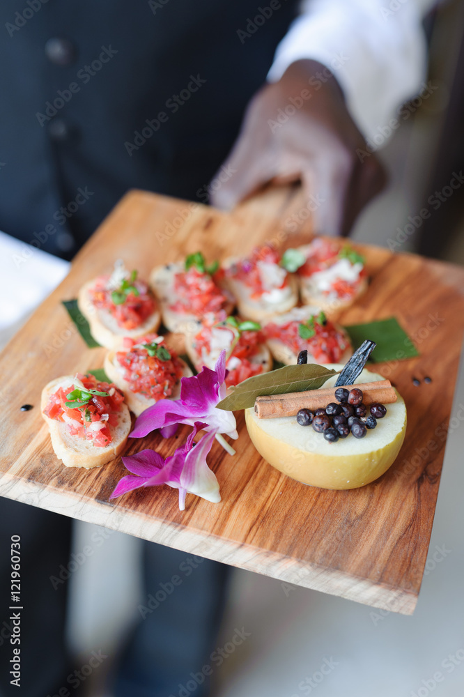 catered food on wooden serving dish catered food on wooden serving dish