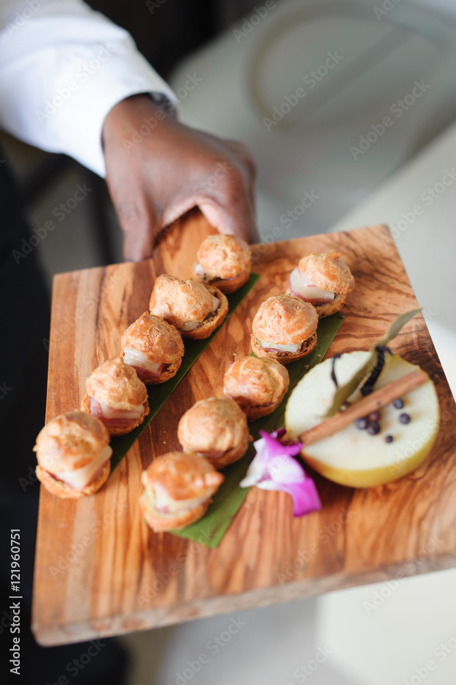 catered food on wooden serving dish