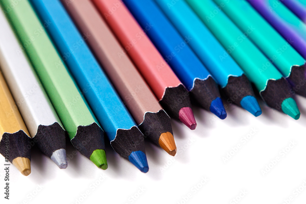 Lapices de colores sobre fondo blanco.Material escolar y educacion.Colores  pastel.Concepto de pintura y dibujo Stock Photo