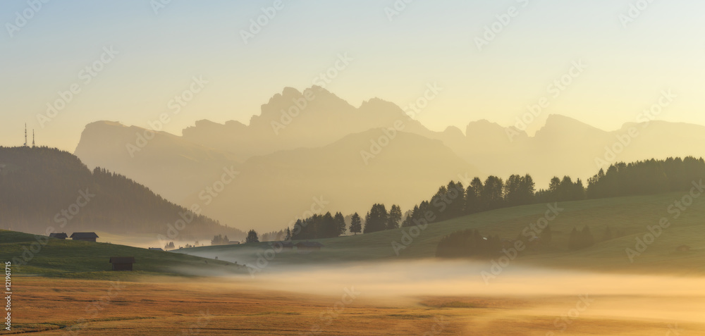 Foggy morning in Alpe di Siusi in Dolomites, Italy