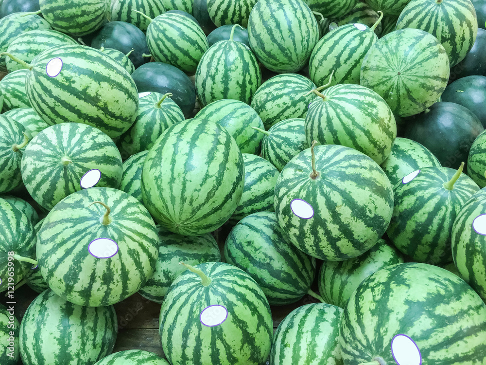 Closeup group of fresh watermelon on wood shelf for sell background Closeup group of fresh watermelon on wood shelf for sell background
