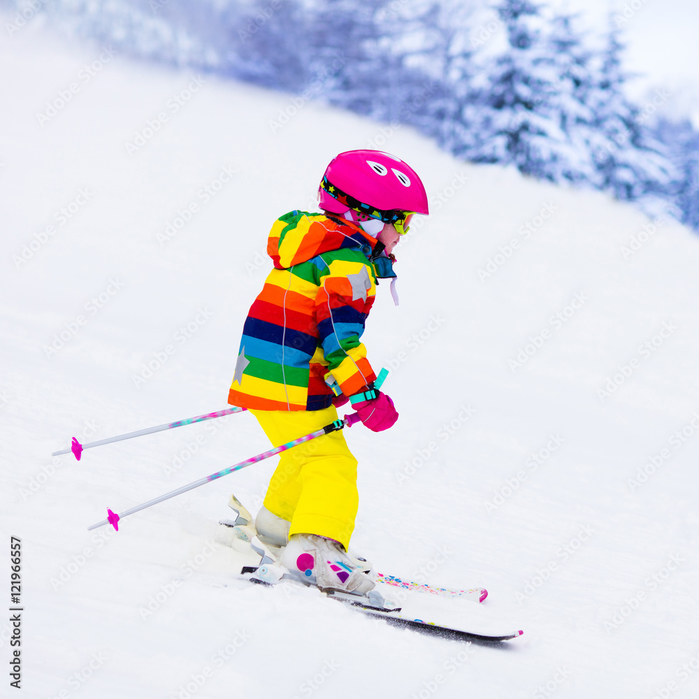 Little girl skiing in the mountains Little girl skiing in the mountains