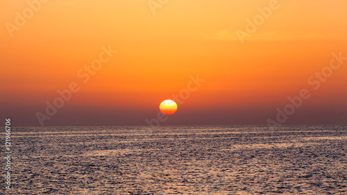 Fototapeta Naklejka Na Ścianę i Meble -  beautiful sunset above the sea.  Colorful sunset over water surf