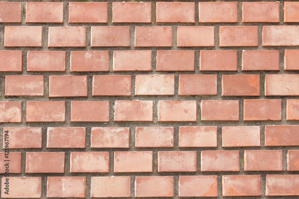 Obraz premium Old red brick wall background macro, selective focus.