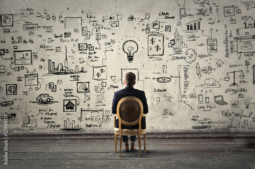Fotografie Businessman trying to solve problems