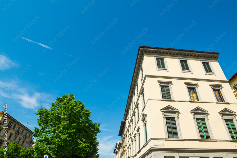 white building and blue sky in Florence