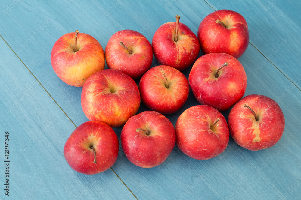 Red apples on a blue table