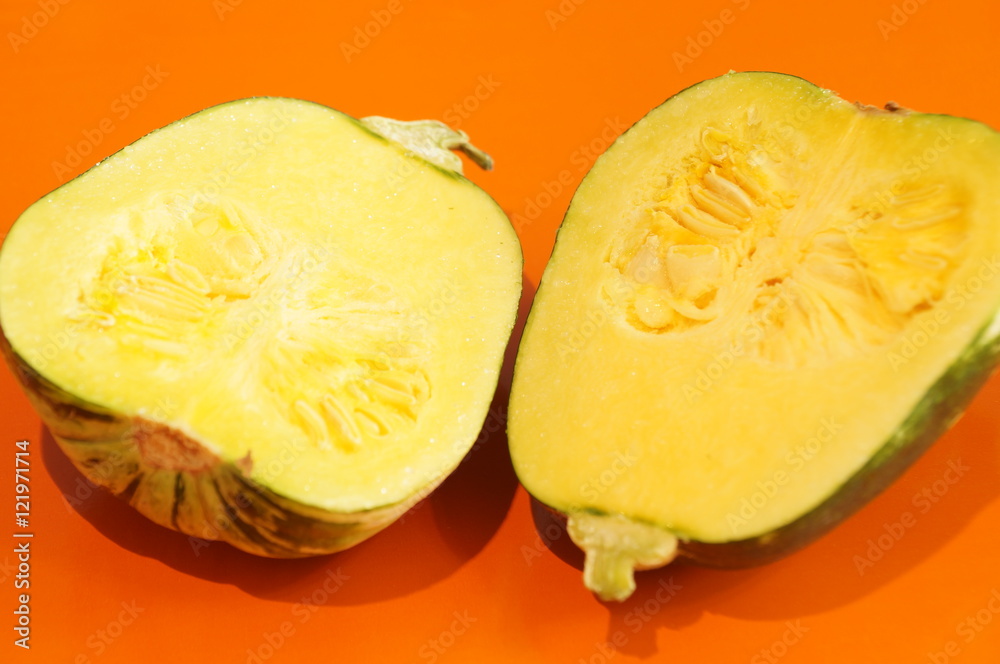 Yellow and ripe pumpkin lie on a bright background. Yellow and ripe pumpkin lie on a bright background.