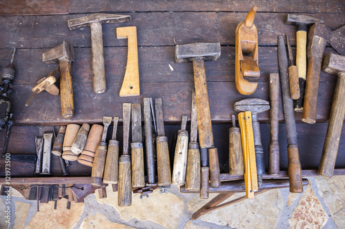 Vintage woodworking tools on a wooden workbench