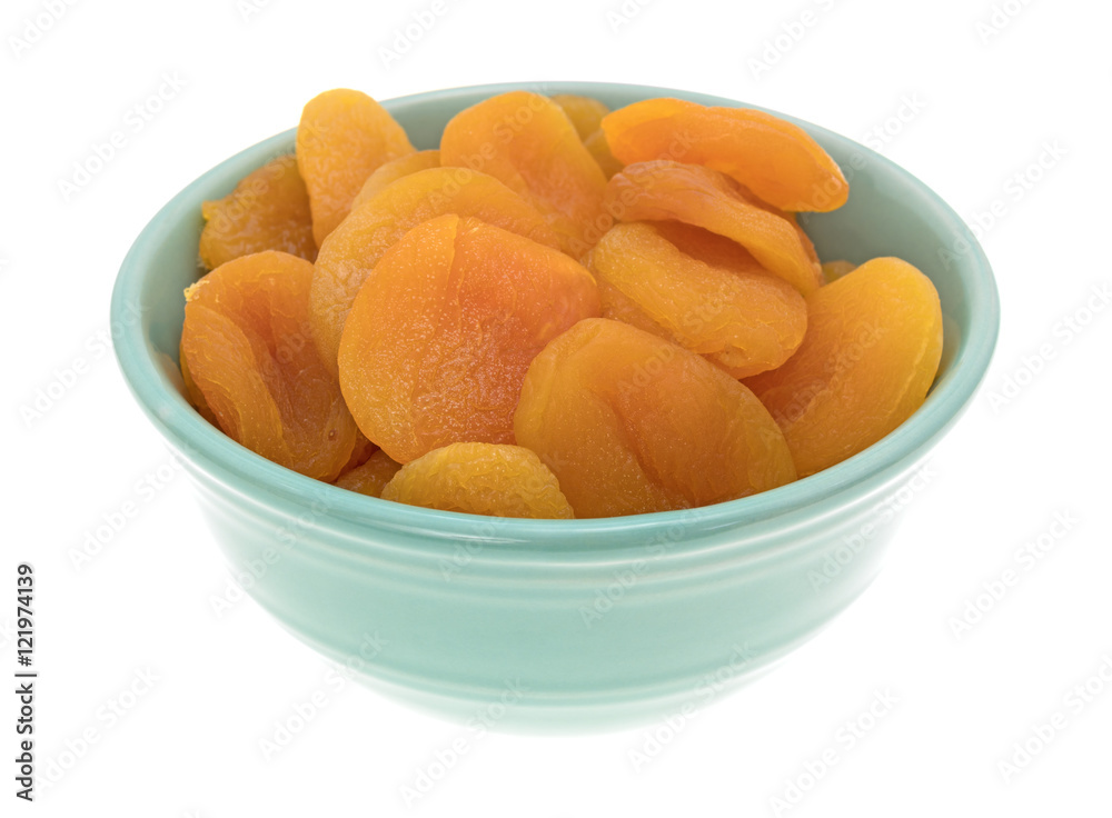 Dried apricots in a green bowl